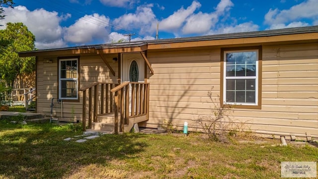 22916 N Oscar St, Harlingen, TX 78552 - doorway to property featuring a yard