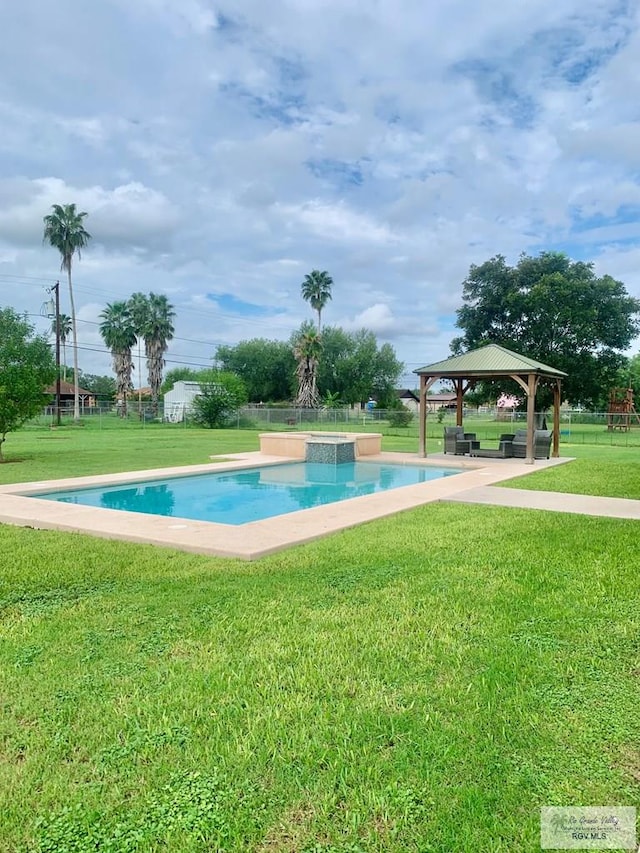 view of pool featuring a gazebo and a lawn