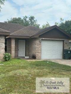 1022 Madison Ave, Harlingen, TX 78550 - ranch-style home with concrete driveway, an attached garage, and a front lawn