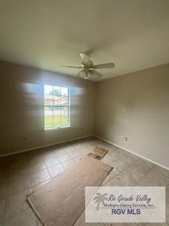 1022 Madison Ave, Harlingen, TX 78550 - empty room with light tile patterned flooring, ceiling fan, and baseboards
