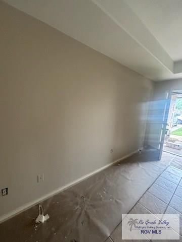 1022 Madison Ave, Harlingen, TX 78550 - spare room with baseboards