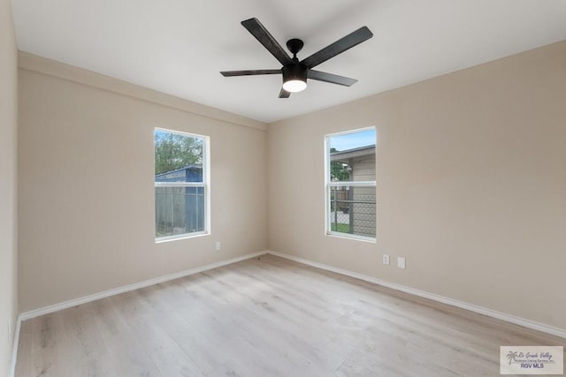 spare room with ceiling fan and light hardwood / wood-style floors