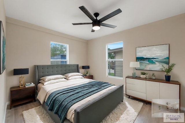 bedroom featuring ceiling fan and wood-type flooring