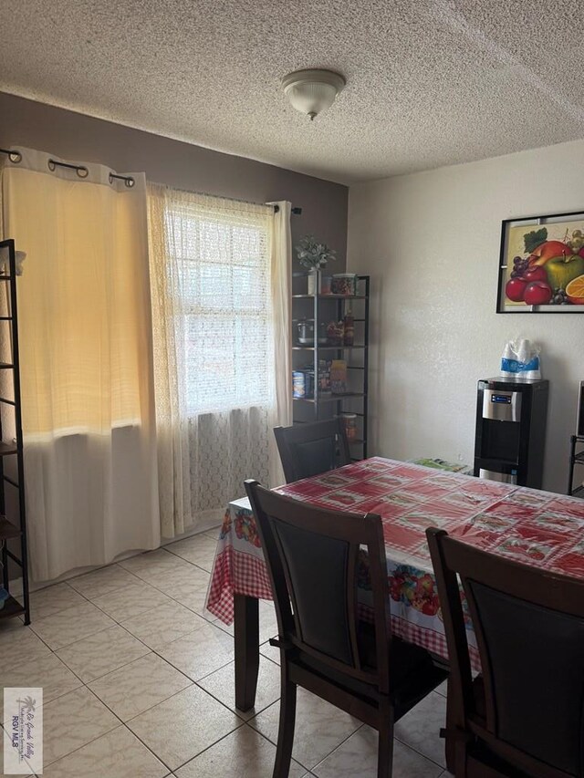 dining area featuring a textured ceiling