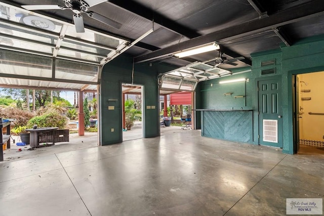 2107 S Victoria Rd, Donna, TX 78537 - garage featuring ceiling fan and visible vents