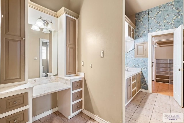 2107 S Victoria Rd, Donna, TX 78537 - full bath featuring baseboards, toilet, vanity, wallpapered walls, and tile patterned flooring