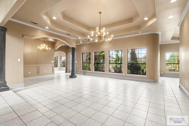 2107 S Victoria Rd, Donna, TX 78537 - empty room with recessed lighting, a notable chandelier, and a raised ceiling