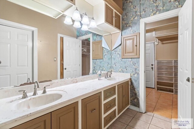 2107 S Victoria Rd, Donna, TX 78537 - full bathroom featuring tile patterned flooring, double vanity, a sink, and wallpapered walls
