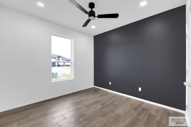 empty room featuring ceiling fan, recessed lighting, wood finished floors, and baseboards