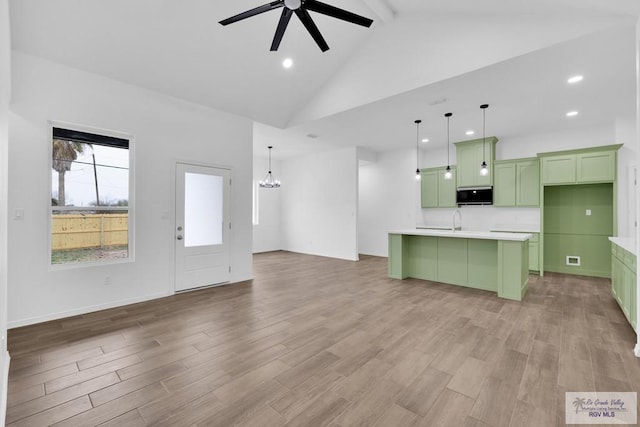 unfurnished living room featuring high vaulted ceiling, light wood-type flooring, recessed lighting, and ceiling fan with notable chandelier