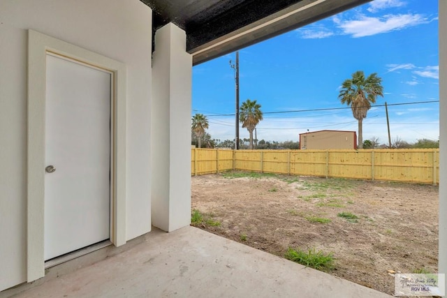 view of yard featuring a patio area and a fenced backyard