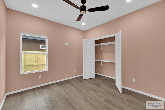 unfurnished bedroom featuring light wood-style flooring, baseboards, a ceiling fan, and recessed lighting