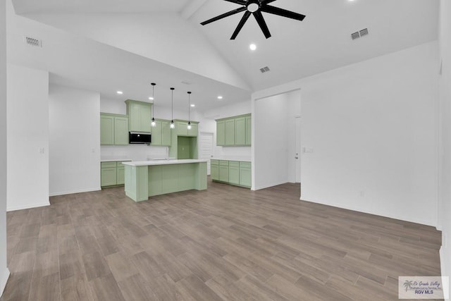 unfurnished living room with light wood-style floors, visible vents, beamed ceiling, and ceiling fan