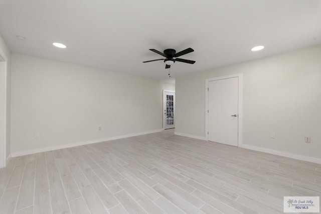 unfurnished room featuring ceiling fan, recessed lighting, light wood-type flooring, and baseboards