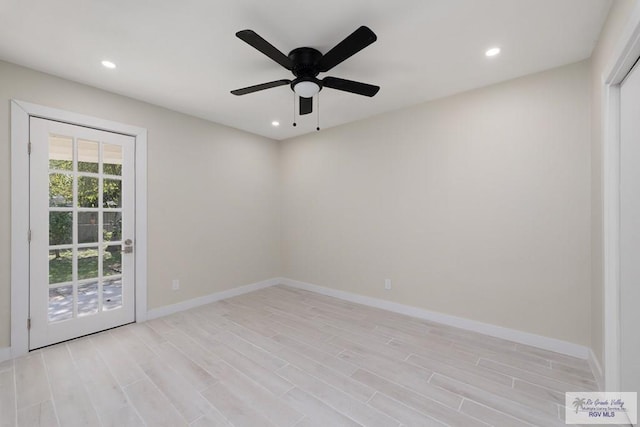 spare room with baseboards, recessed lighting, a ceiling fan, and light wood-style floors