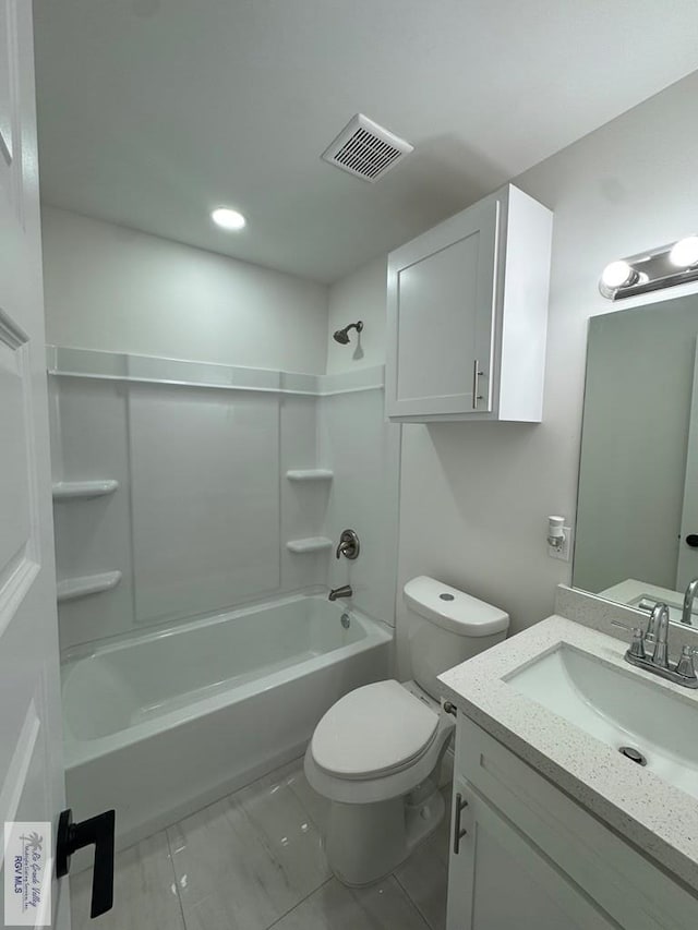 full bathroom featuring vanity, tile patterned floors, toilet, and shower / bath combination