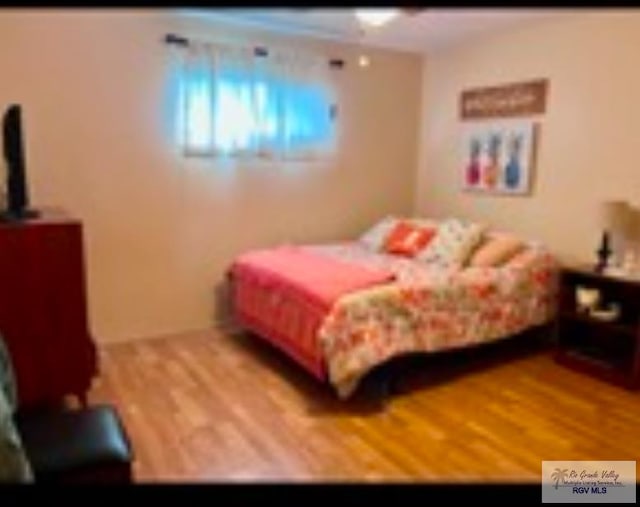 bedroom featuring hardwood / wood-style flooring