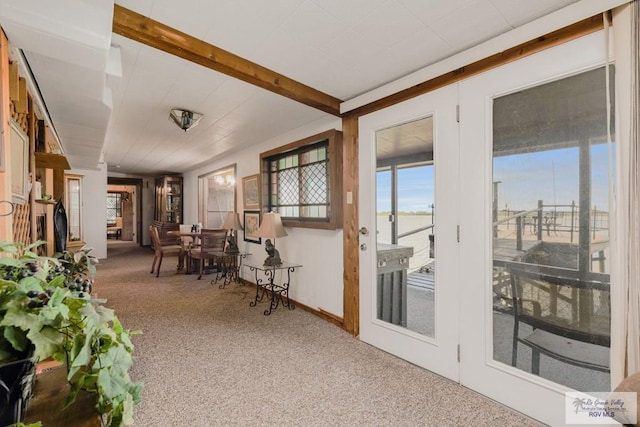 sunroom with beam ceiling