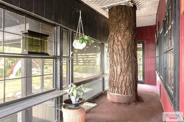 unfurnished sunroom featuring plenty of natural light