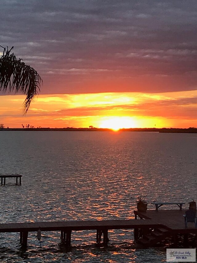 property view of water featuring a boat dock