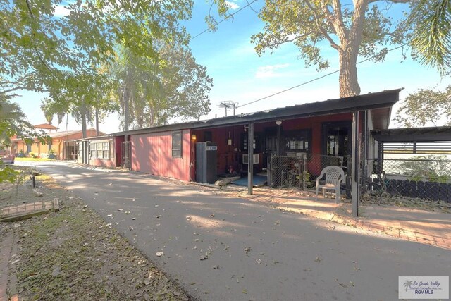 view of front of home with a carport