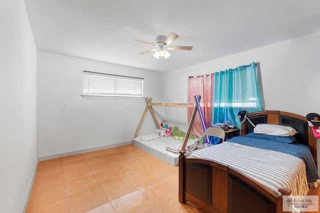 bedroom featuring ceiling fan and baseboards