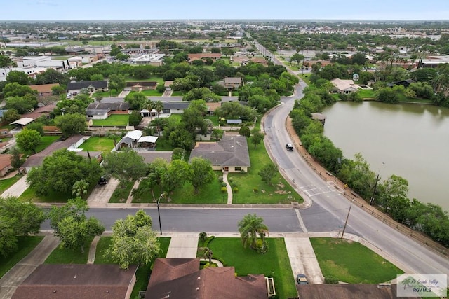 birds eye view of property featuring a water view and a residential view