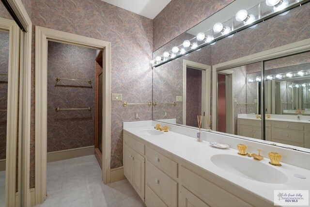 bathroom with vanity and an enclosed shower