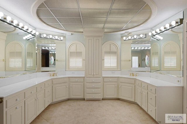 1700 Tesoro Ave, Rancho Viejo, TX 78575 - full bath featuring double vanity, ornate columns, and tile patterned flooring