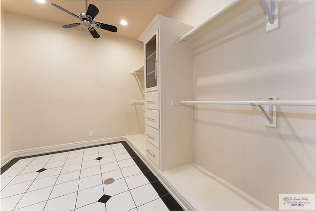 spacious closet featuring ceiling fan and light tile patterned floors