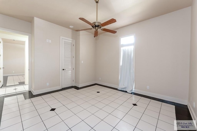 unfurnished room featuring light tile patterned floors and ceiling fan