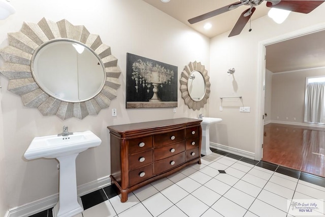 bathroom featuring hardwood / wood-style flooring, ceiling fan, and sink