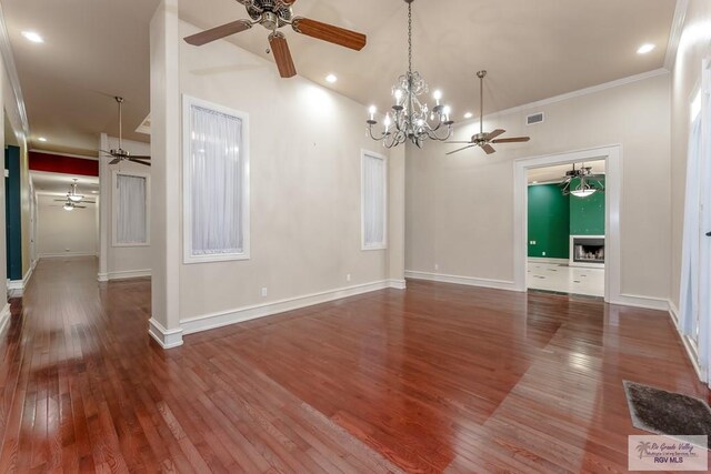 405 E Matz Ave, Harlingen, TX 78550 - unfurnished room featuring ceiling fan, hardwood / wood-style floors, a chandelier, crown molding, and recessed lighting