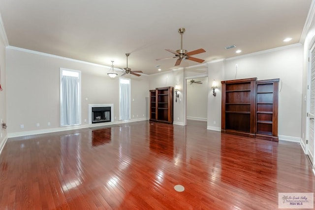 unfurnished living room with crown molding, ceiling fan, and dark wood-type flooring