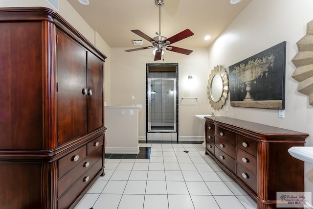 bathroom featuring ceiling fan and tile patterned flooring