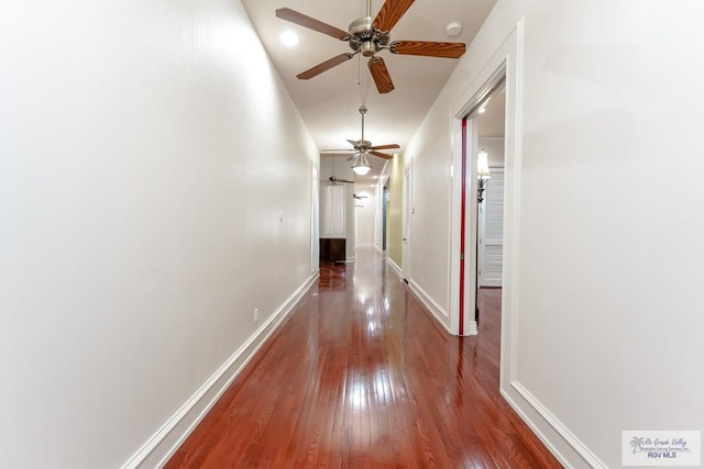 hall with hardwood / wood-style flooring