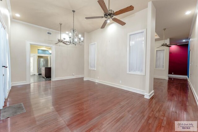 405 E Matz Ave, Harlingen, TX 78550 - spare room featuring ceiling fan, wood finished floors, a chandelier, baseboards, and crown molding