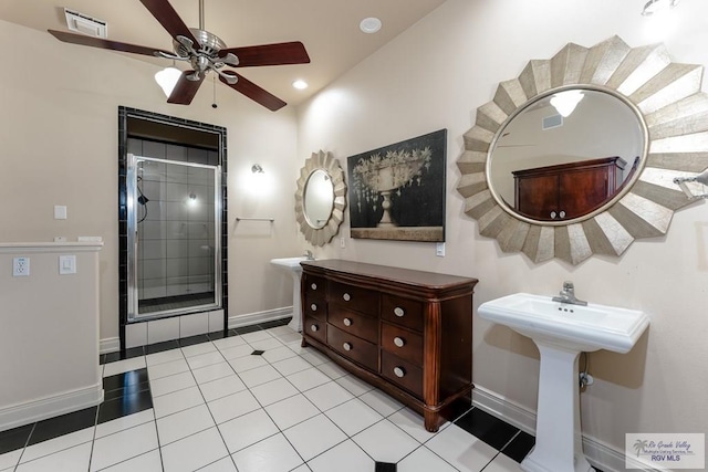 bathroom featuring tile patterned flooring, vaulted ceiling, and ceiling fan