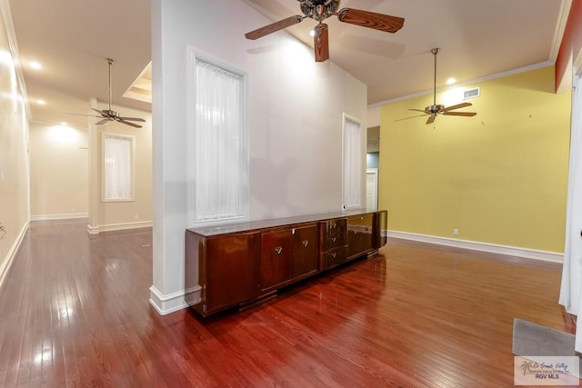 unfurnished living room with crown molding and dark hardwood / wood-style floors