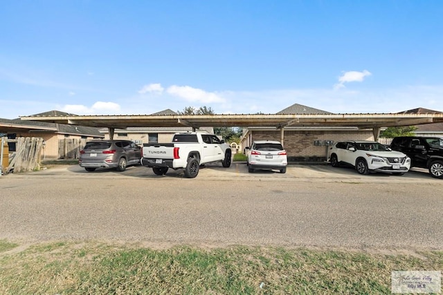 view of vehicle parking with a carport