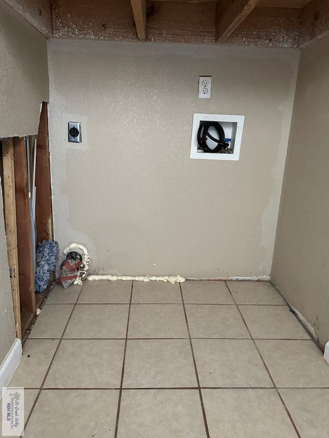 laundry room with washer hookup, electric dryer hookup, and light tile patterned flooring