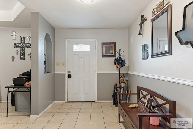 entrance foyer with light tile patterned floors