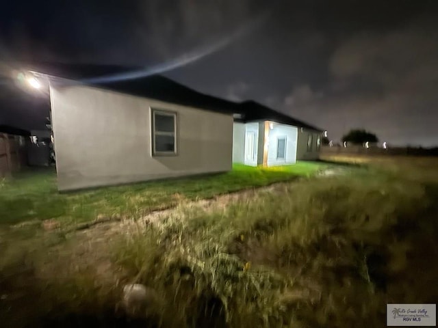 view of back of house at twilight