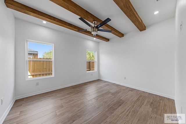 unfurnished room featuring ceiling fan, beamed ceiling, and light hardwood / wood-style floors