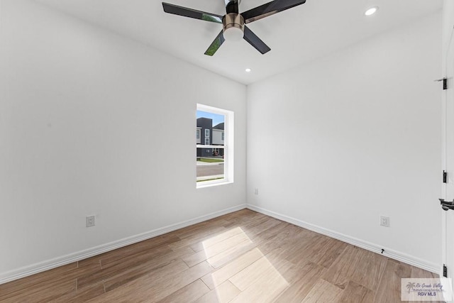 unfurnished room with light hardwood / wood-style floors