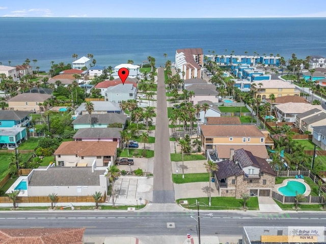 213B W Cora Lee Dr Unit B, South Padre Island, TX 78597 - aerial view of residential area featuring a large body of water and a pool area