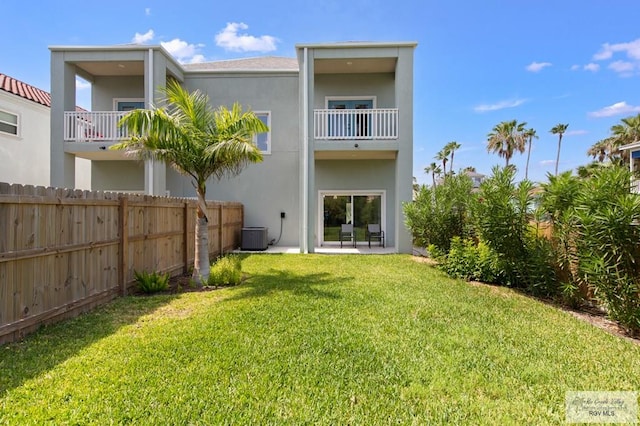 213B W Cora Lee Dr Unit B, South Padre Island, TX 78597 - rear view of house featuring a balcony and stucco siding
