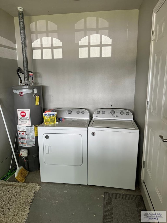 laundry area with washer and dryer and gas water heater