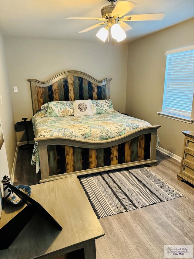 bedroom featuring ceiling fan and wood-type flooring