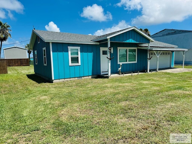 single story home featuring a front yard and a garage